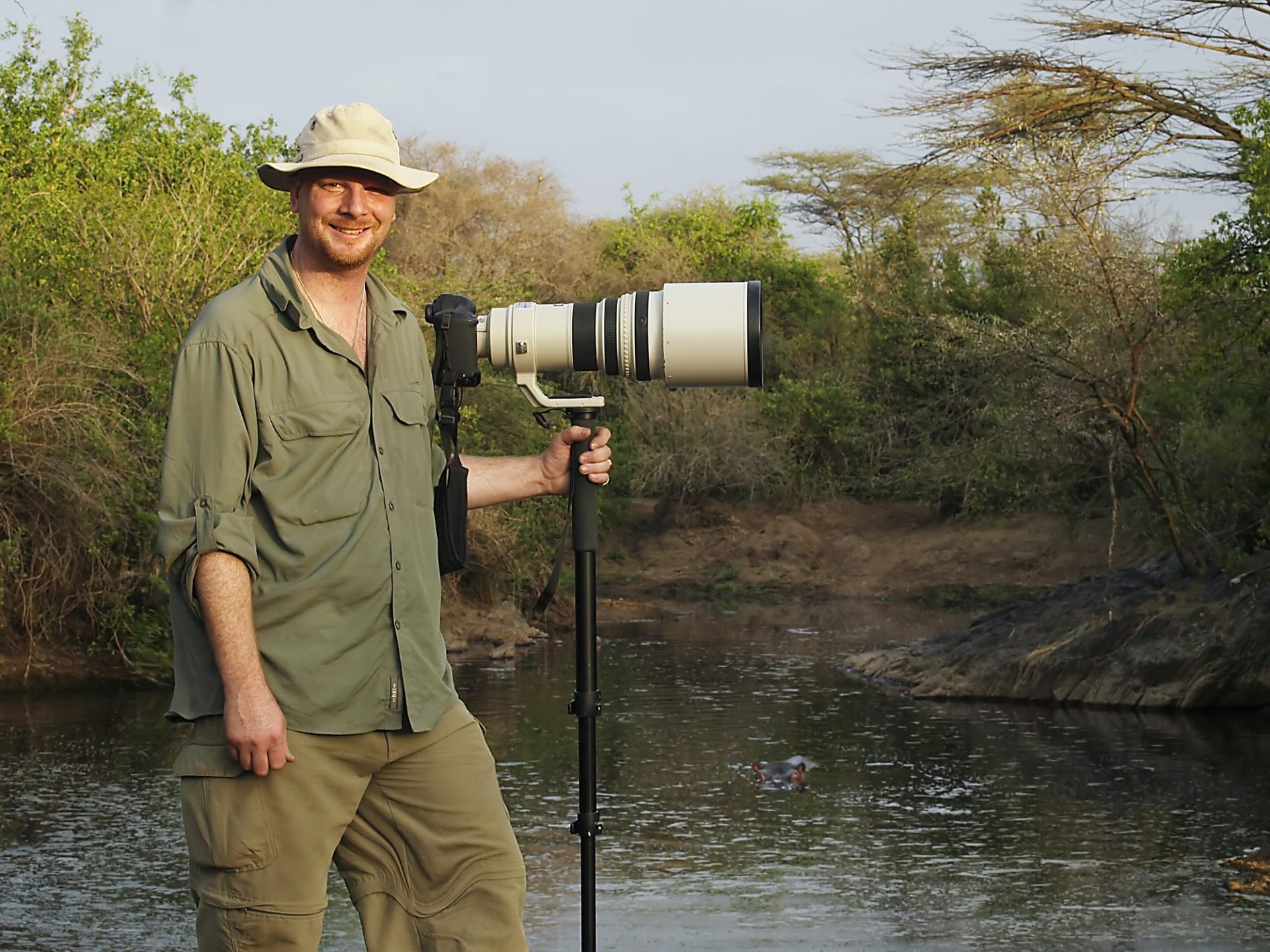 wildlife-photographer-with-long-lens-on-camera-in-africa.jpg